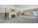 Living room with fireplace, ready for renovation at 141 N Adams Dr, Sarasota, FL 34236