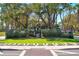 Landscaped park with a statue at 141 N Adams Dr, Sarasota, FL 34236
