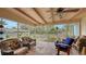 Relaxing screened porch with patio furniture at 141 N Adams Dr, Sarasota, FL 34236
