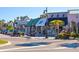 Shops and restaurants along a tree-lined street at 141 N Adams Dr, Sarasota, FL 34236