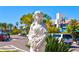 Statue in a landscaped traffic circle near shops at 141 N Adams Dr, Sarasota, FL 34236