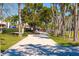 Walkway through a park-like area at 141 N Adams Dr, Sarasota, FL 34236