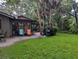 Private backyard with grassy area and patio for outdoor enjoyment at 1507 Water Oak Way S, Bradenton, FL 34209