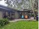 Spacious backyard with patio, seating area, and lush landscaping at 1507 Water Oak Way S, Bradenton, FL 34209