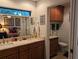 Spacious bathroom with double sinks, toilet, and built-in cabinetry at 1507 Water Oak Way S, Bradenton, FL 34209