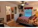 Main bedroom with ensuite bathroom and a leafy view at 1507 Water Oak Way S, Bradenton, FL 34209