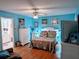 Bright bedroom with double bed, hardwood floors, and ceiling fan at 1507 Water Oak Way S, Bradenton, FL 34209
