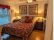Cozy bedroom with a double bed and lovely wall art at 1507 Water Oak Way S, Bradenton, FL 34209