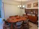Mid-century modern style dining room with round table and hutch at 1507 Water Oak Way S, Bradenton, FL 34209
