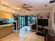 Bright living room with access to sunroom and kitchen at 1507 Water Oak Way S, Bradenton, FL 34209