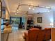 Open living area with tile flooring and a view to the kitchen at 1507 Water Oak Way S, Bradenton, FL 34209