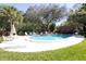 Inviting community pool with surrounding lounge chairs at 1507 Water Oak Way S, Bradenton, FL 34209