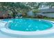 Relaxing kidney-shaped community pool with surrounding patio at 1507 Water Oak Way S, Bradenton, FL 34209