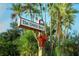The Oaks Blvd street sign with a festive bow at 1507 Water Oak Way S, Bradenton, FL 34209