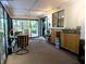 Bright sunroom with access to backyard and built-in cabinets at 1507 Water Oak Way S, Bradenton, FL 34209