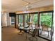 Sunroom with access to backyard patio and seating area at 1507 Water Oak Way S, Bradenton, FL 34209
