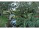 Peaceful waterway view, surrounded by lush greenery at 1507 Water Oak Way S, Bradenton, FL 34209