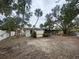 Large backyard with mature trees and a shed at 175 Island Cir, Sarasota, FL 34242