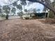 Backyard view showing a shed, patio, and fenced area at 175 Island Cir, Sarasota, FL 34242
