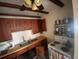 Galley-style kitchen with wood cabinets and stove at 175 Island Cir, Sarasota, FL 34242