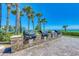 Beachfront grilling area with multiple grills for cookouts at 1945 Gulf Of Mexico Dr # M2-313, Longboat Key, FL 34228