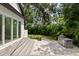 Outdoor patio area with built-in grill and lush landscaping at 2174 Mcclellan Pkwy, Sarasota, FL 34239