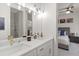 Double vanity bathroom with a view into bedroom at 2174 Mcclellan Pkwy, Sarasota, FL 34239