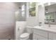 Clean bathroom with shower, toilet, and vanity at 2174 Mcclellan Pkwy, Sarasota, FL 34239