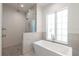 Spa-like bathroom with walk-in shower and soaking tub at 2174 Mcclellan Pkwy, Sarasota, FL 34239
