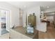 Bright home office with built-in desk and view into kitchen area at 2174 Mcclellan Pkwy, Sarasota, FL 34239