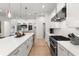 Modern kitchen with stainless steel appliances and white shaker cabinets at 2174 Mcclellan Pkwy, Sarasota, FL 34239