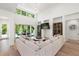 Living area with sectional sofa, access to backyard, and built-in shelving at 2174 Mcclellan Pkwy, Sarasota, FL 34239