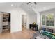 Spacious playroom with wood floors, built-in storage, and large window at 2174 Mcclellan Pkwy, Sarasota, FL 34239