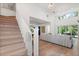 Modern staircase with white railing and light hardwood treads at 2174 Mcclellan Pkwy, Sarasota, FL 34239