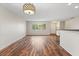 Bright living room with wood-look floors and large window at 2410 33Rd W St, Bradenton, FL 34205