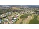 Aerial view showcasing home's location in a golf course community at 2611 Little Country Rd, Parrish, FL 34219