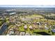 Wide aerial view of house and surrounding golf course community at 2611 Little Country Rd, Parrish, FL 34219