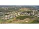Bird's-eye view of house near lake and golf course at 2611 Little Country Rd, Parrish, FL 34219