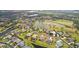 Wide aerial view of house and surrounding golf course community at 2611 Little Country Rd, Parrish, FL 34219