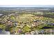 Wide aerial view of house and surrounding golf course community at 2611 Little Country Rd, Parrish, FL 34219