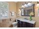 Bathroom with granite vanity and walk-in shower at 2611 Little Country Rd, Parrish, FL 34219