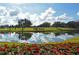 Landscaped area with lake and golf course view at 2611 Little Country Rd, Parrish, FL 34219