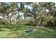 Relaxing park with bench under shade trees at 2611 Little Country Rd, Parrish, FL 34219
