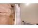 Shower stall with tiled walls and a shower curtain at 2651 Leafy Ln, Sarasota, FL 34239