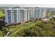 Luxury condo building with pool and lush landscaping at 2925 Terra Ceia Bay Blvd # 2203, Palmetto, FL 34221