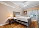 Cozy bedroom with a queen-size bed and hardwood floors at 2925 Terra Ceia Bay Blvd # 2203, Palmetto, FL 34221