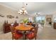 Round dining table with seating for six in open floor plan at 2925 Terra Ceia Bay Blvd # 2203, Palmetto, FL 34221