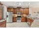 Well-equipped kitchen featuring wood cabinets and granite counters at 2925 Terra Ceia Bay Blvd # 2203, Palmetto, FL 34221