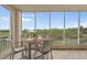 Relaxing screened balcony with table and chairs, offering scenic views at 2925 Terra Ceia Bay Blvd # 2203, Palmetto, FL 34221
