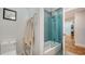 Spa-like bathroom with herringbone tile and a modern bathtub at 302 45Th W St, Bradenton, FL 34209